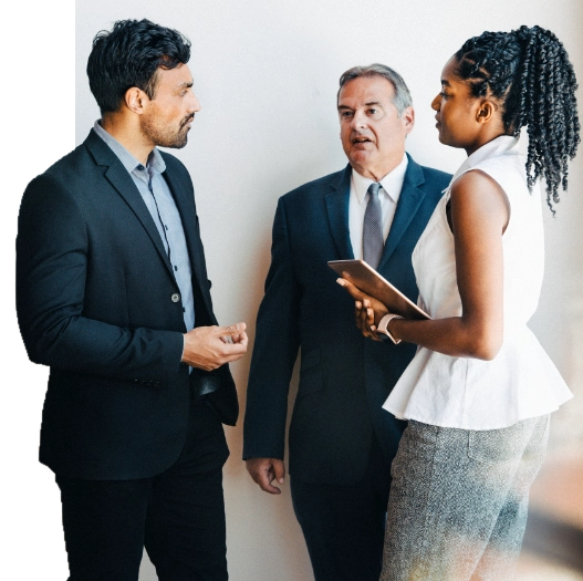 Corporate event hall with round tables and chairs surrounding the perimeter